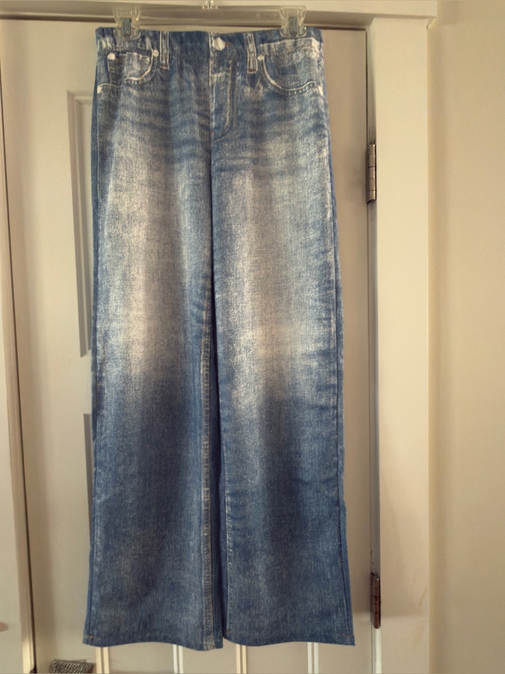 Two pair of new jeggings, one darker blue Acid-Wash design, one lighter.